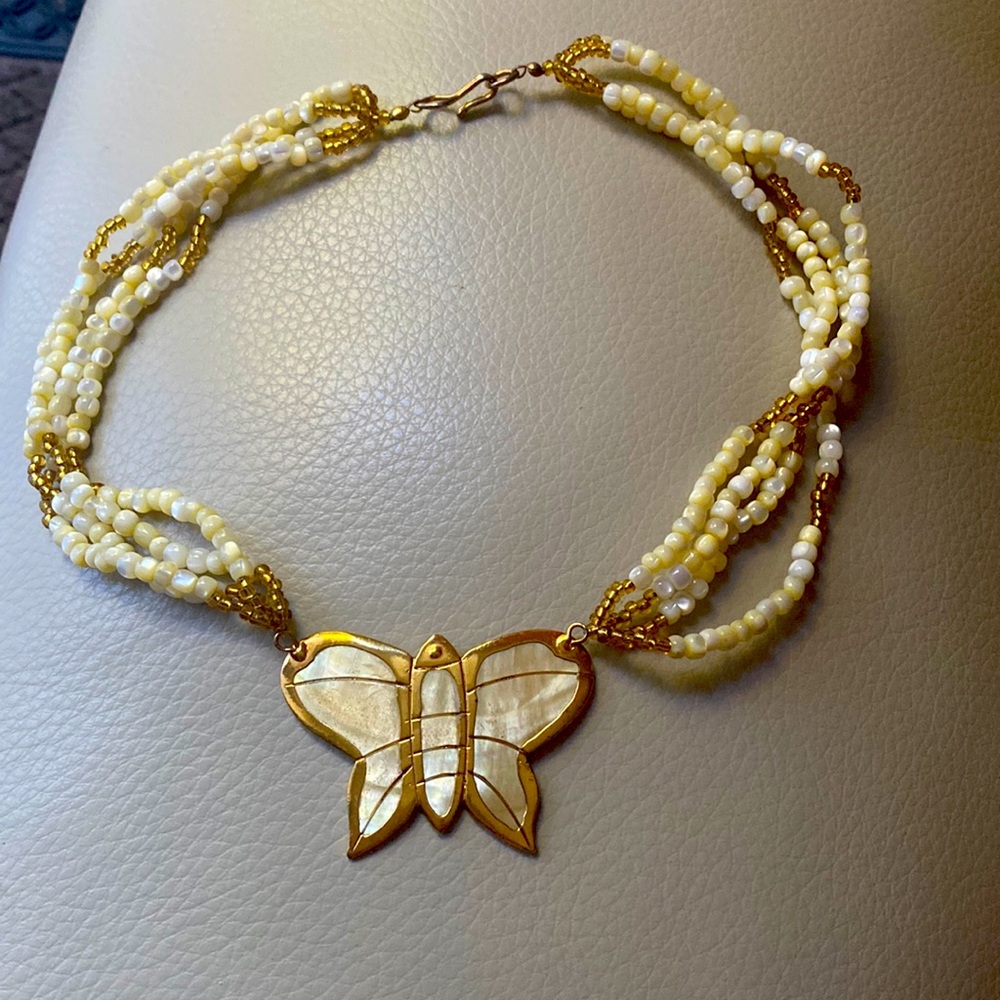 Mother of pear butterfly necklace with opalescent mother of pearl multi strands